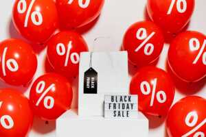 Logo Black Friday et ballons rouges avec symbole %, car iPhone 14 reconditionné à -63% chez Certideal